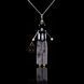 SARANA&reg; &ldquo;Gentleman&rdquo; jewelry doll pendant with black agate on a black background