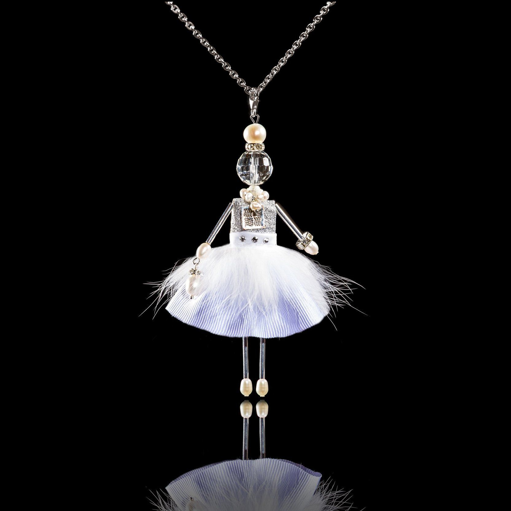 Jewelry doll pendant "Fluffy Snowflake" on a black background