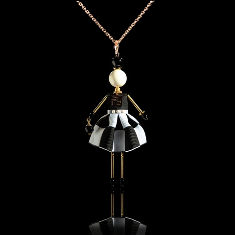 Elegant doll pendant in black and white.