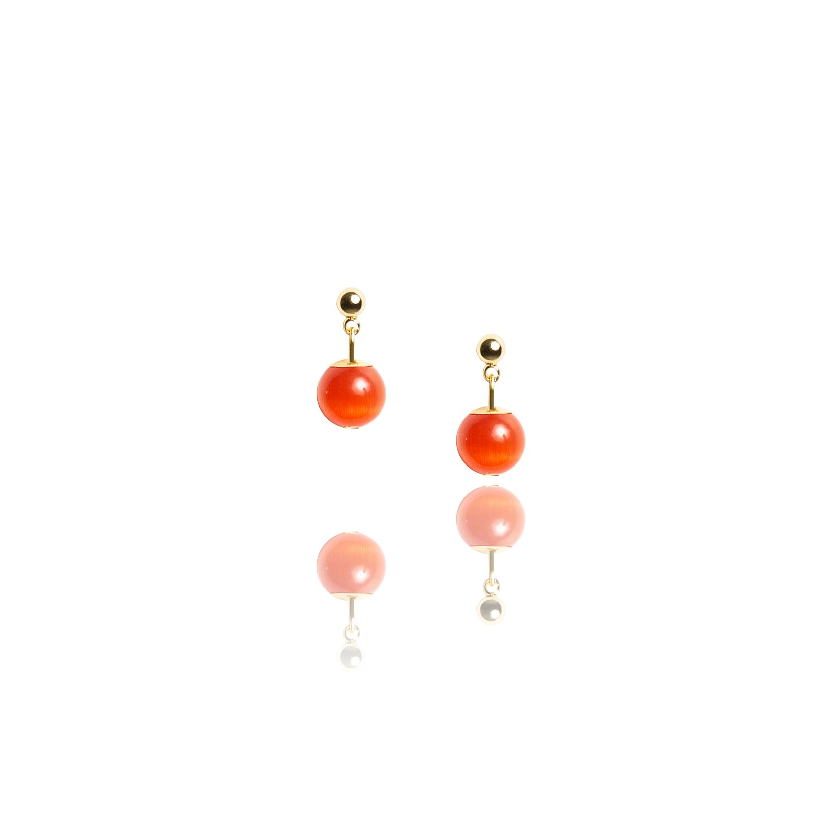 Small stud earrings with an orange stone.