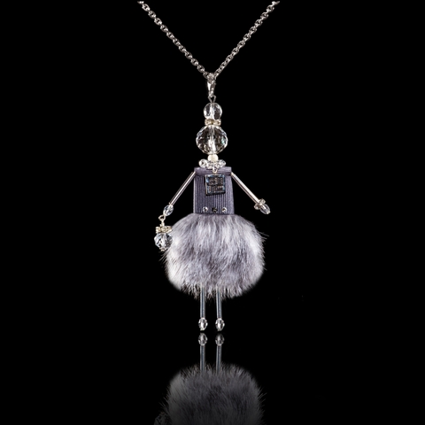 Doll pendant with grey fur.