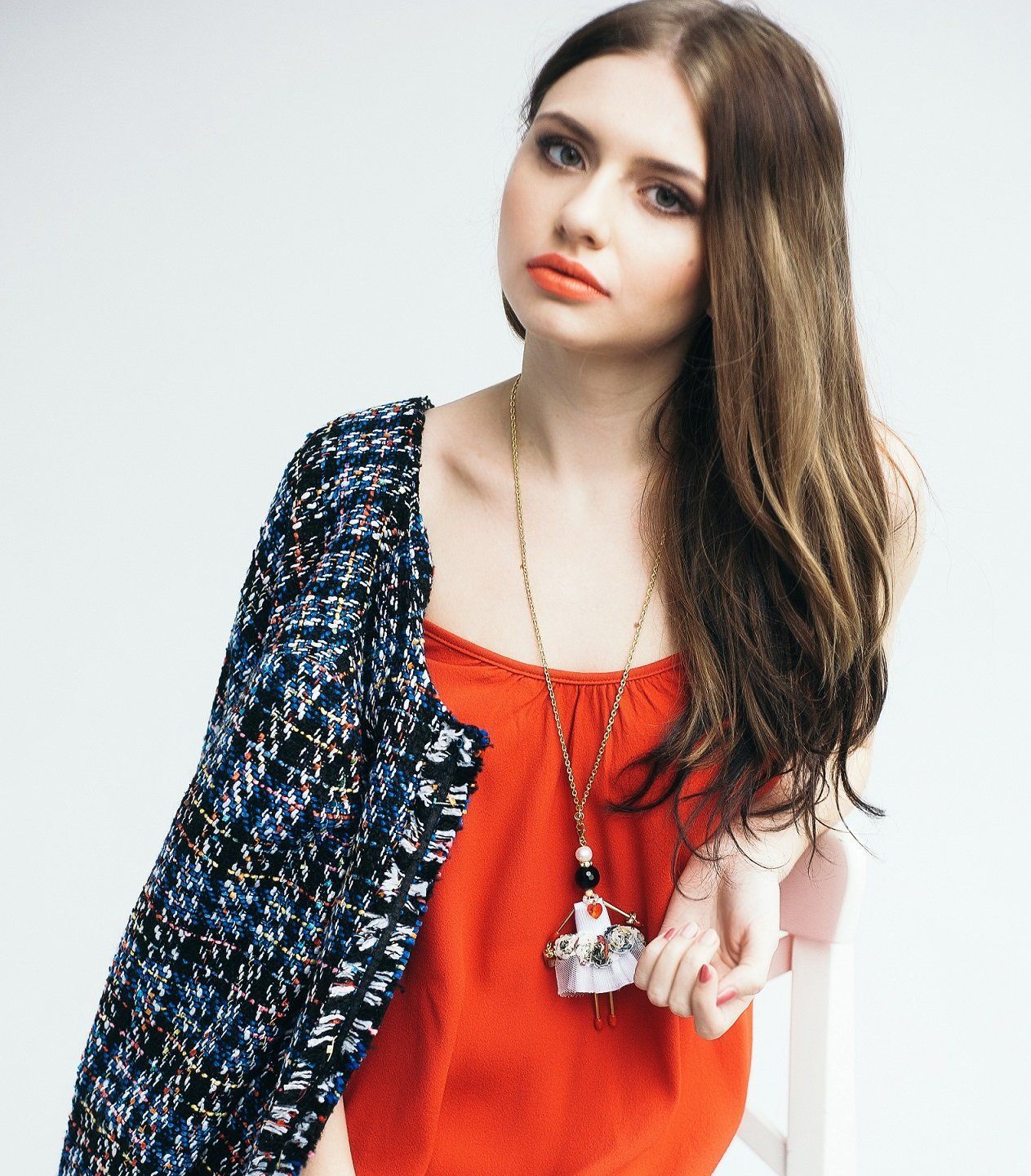SARANA jewelry doll pendant &ldquo;Coquette&rdquo; worn by model in elegant fashion look