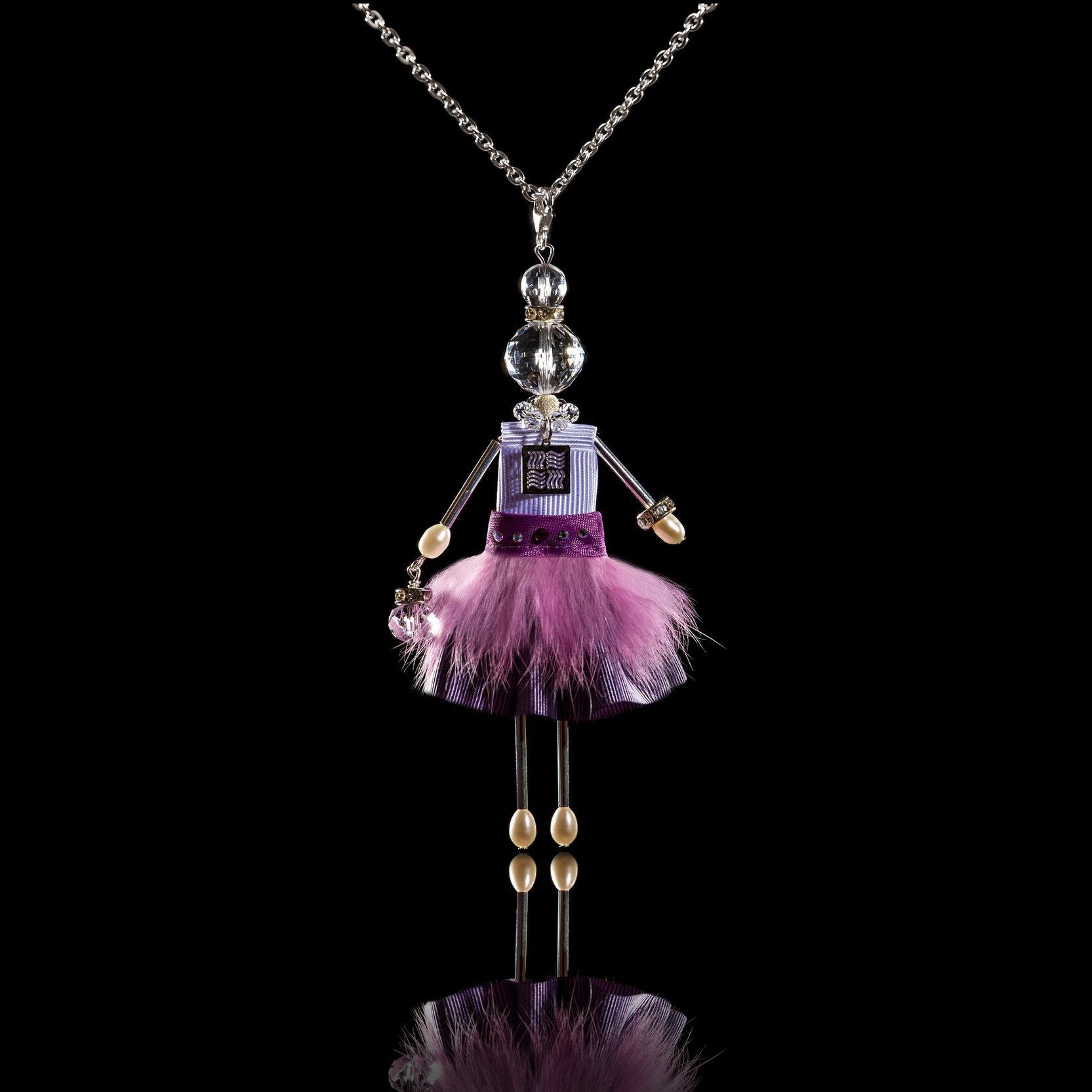Jewelry doll pendant "Lilac Snowflake" on a black background