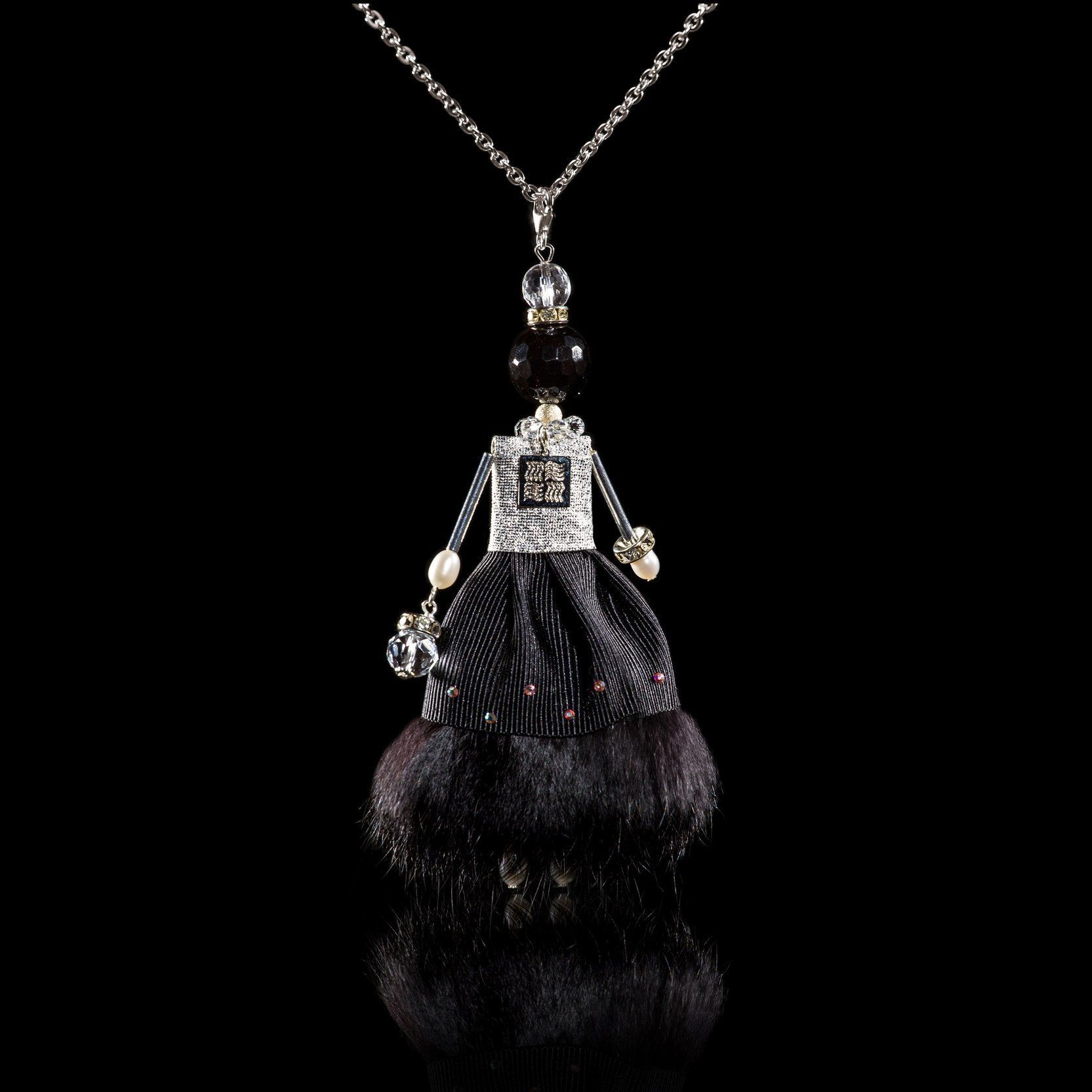 Jewelry doll pendant "Lady in Black" on a black background