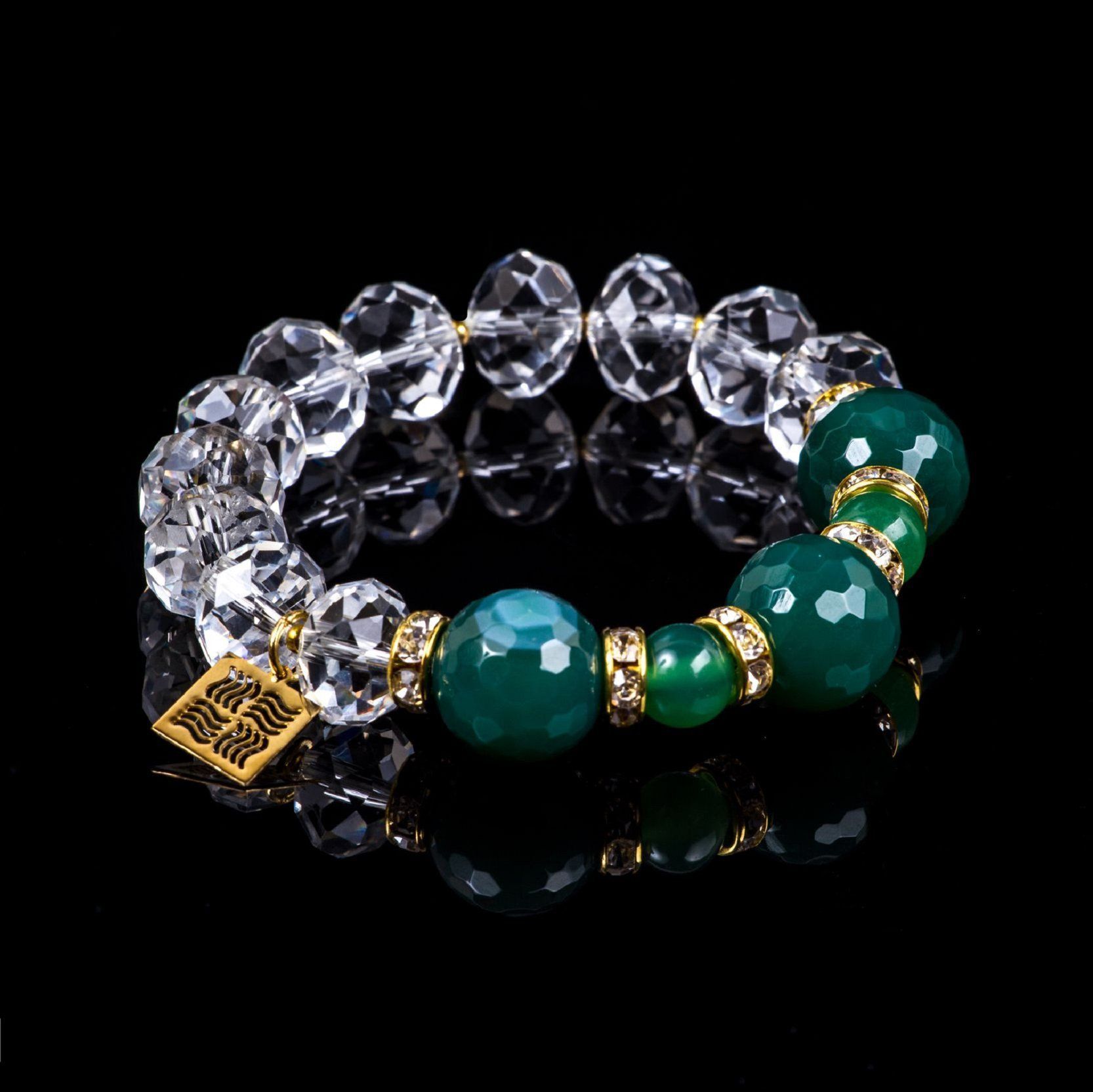 Crystal bracelet with green agate and jade on black background