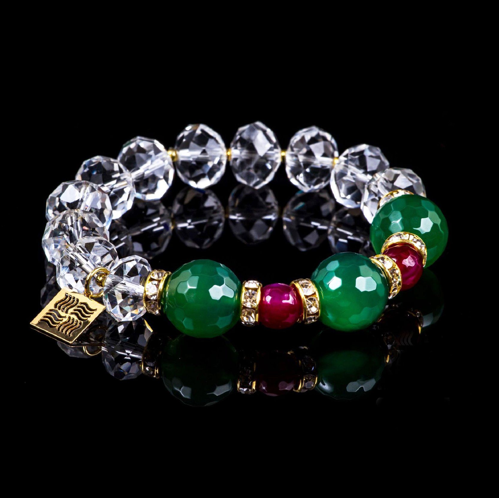 Crystal bracelet with green agate and fuchsia agate beads on black background