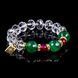 Crystal bracelet with green agate and fuchsia agate beads on black background