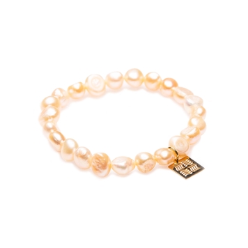 Delicate pearl bracelet of light peach color