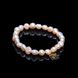 Delicate pearl bracelet of light peach color
