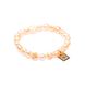 Delicate pearl bracelet of light peach color