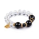 Crystal bracelet with natural black agates and zirconia accents on white background