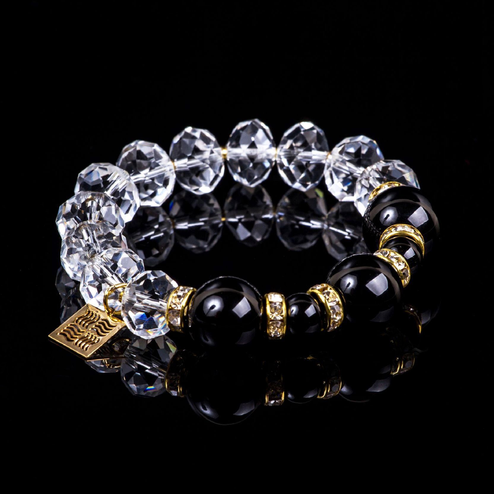 Elegant crystal bracelet with natural black agates on black background