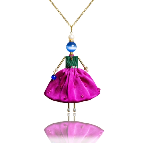Bold pendant doll in a pink fuchsia silk skirt.