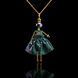 SARANA&reg; Mira Jewelry Doll Pendant on a black background