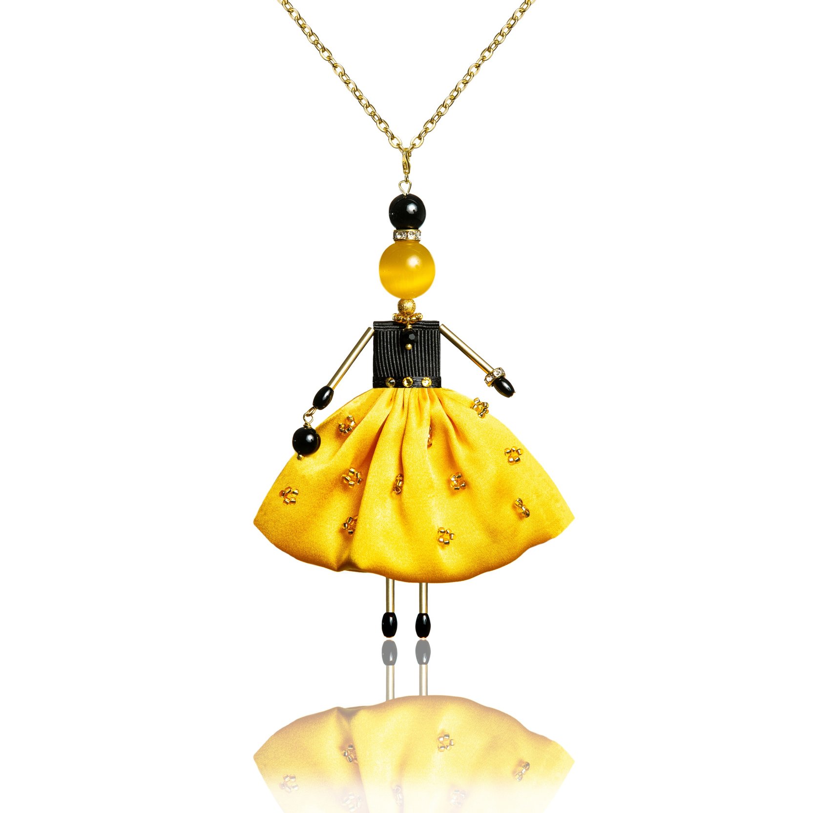 Bright doll-pendant in a silk skirt of sunny color.