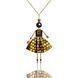 SARANA&reg; Aurelia Jewelry Doll Pendant on a chain on a black background