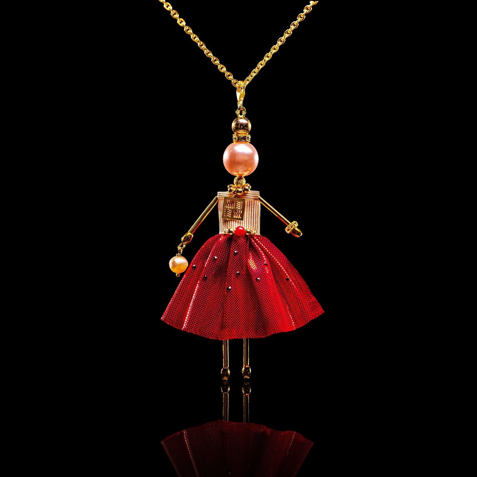 SARANA&reg; Vesta Jewelry Doll Pendant on a black background