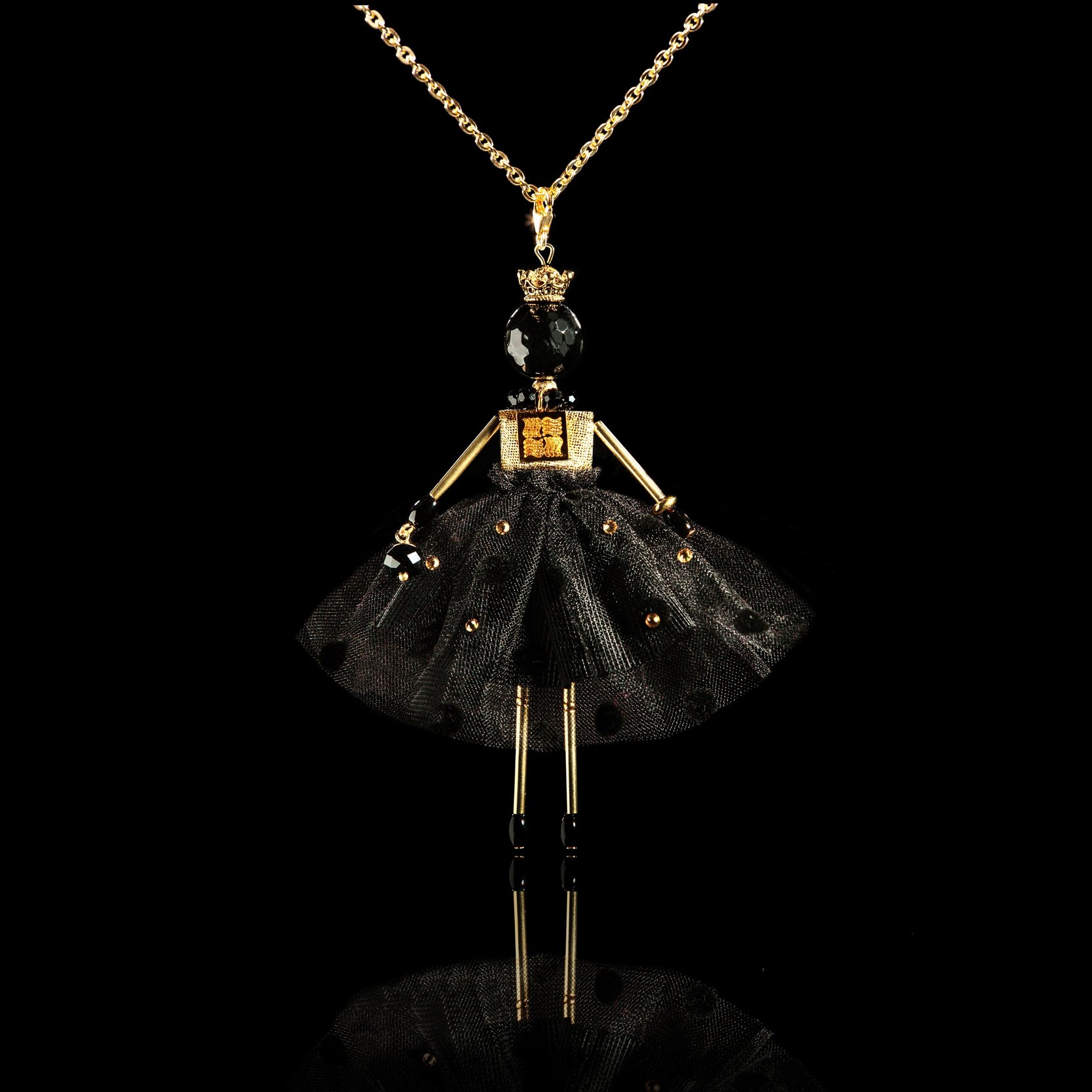 The pendant doll is the majestic Black Queen.