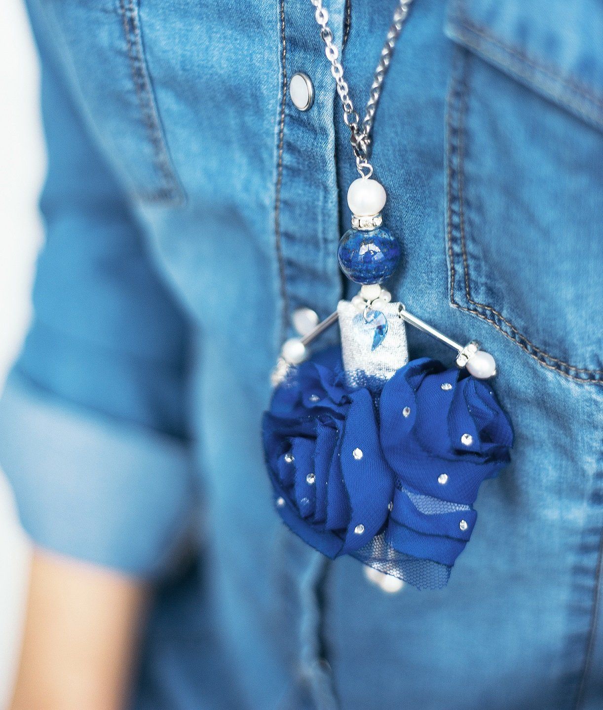 Close-up SARANA jewelry doll pendant &ldquo;Snow Queen&rdquo; on model