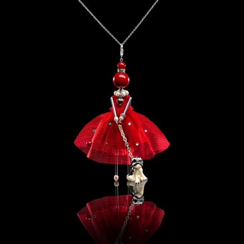 Charming pendant doll in red with a dog.