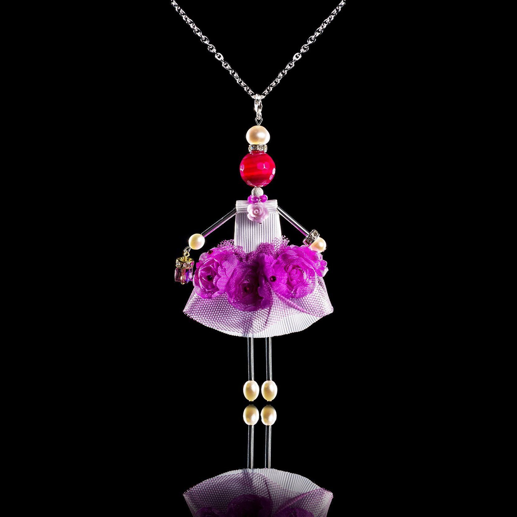 Purple Orchid doll pendant jewelry with Swarovski crystals on black background