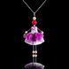 Purple Orchid doll pendant jewelry with Swarovski crystals on black background