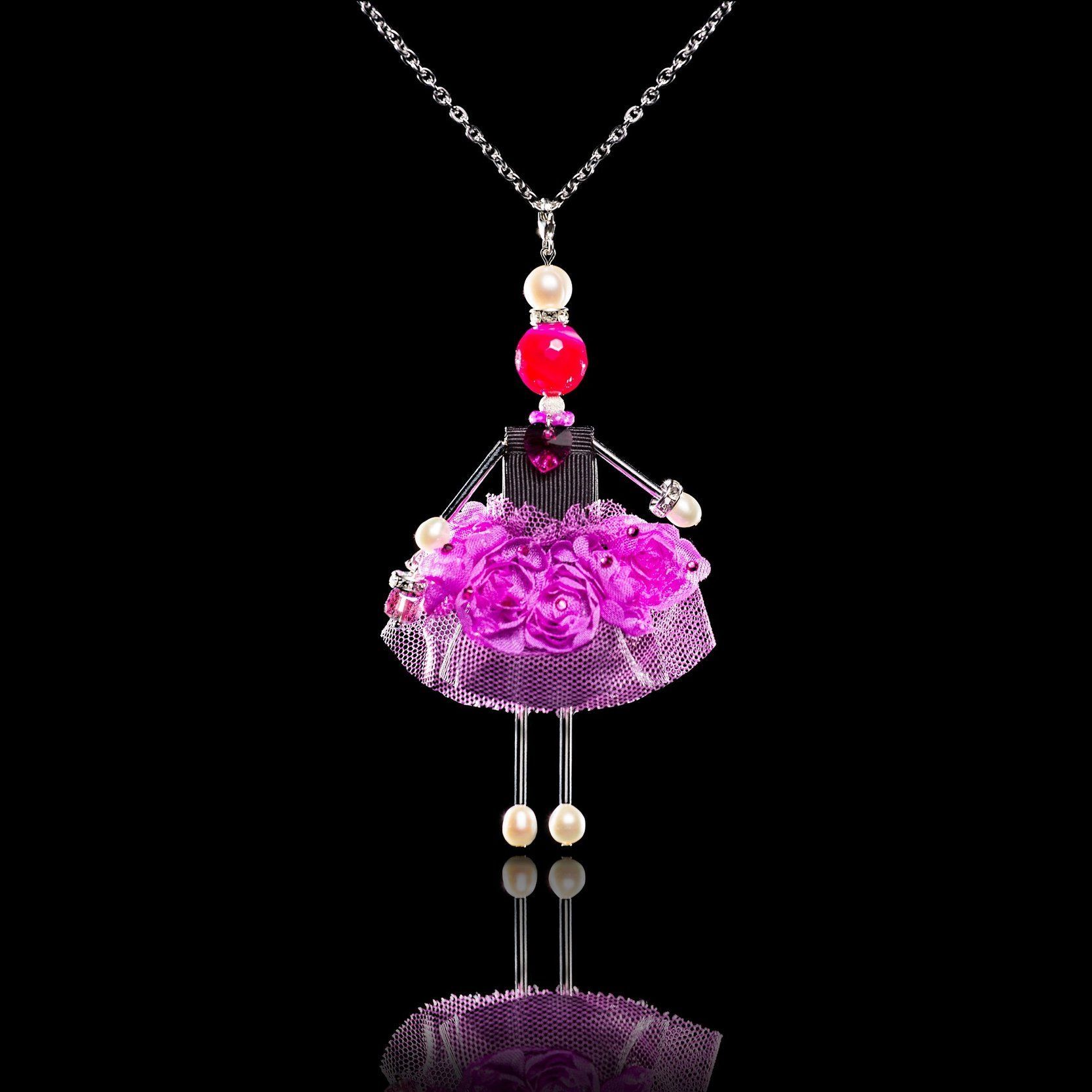 Black Orchid jewelry doll pendant on a black background | evening jewelry aesthetic