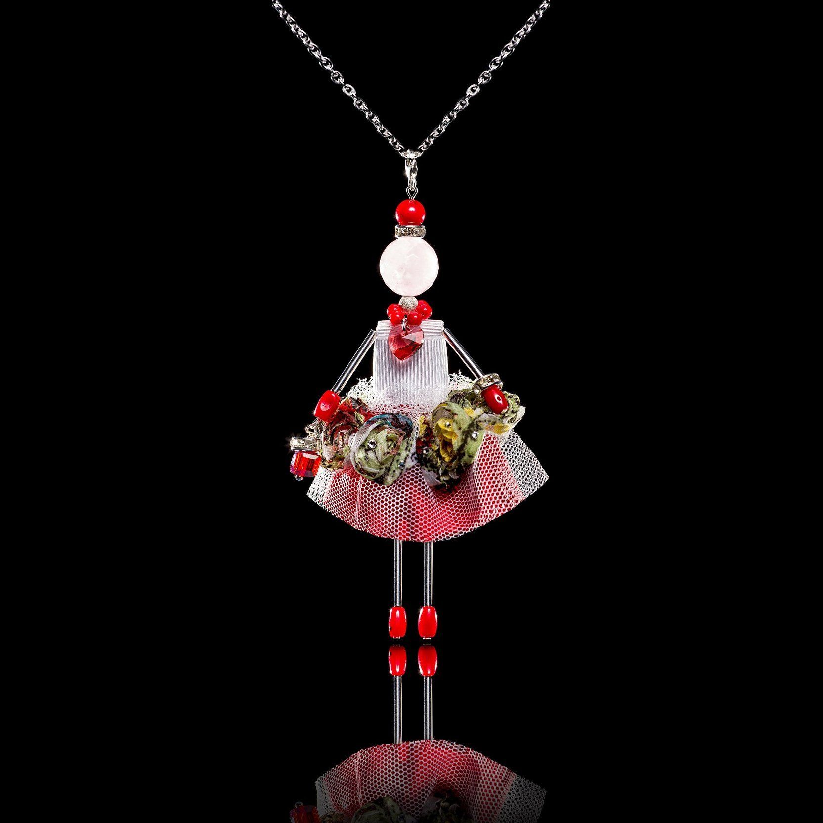 Little Queen jewelry doll pendant on black background