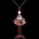 Little Queen jewelry doll pendant on black background