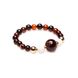 An agate bracelet in the color of brown mahogany.