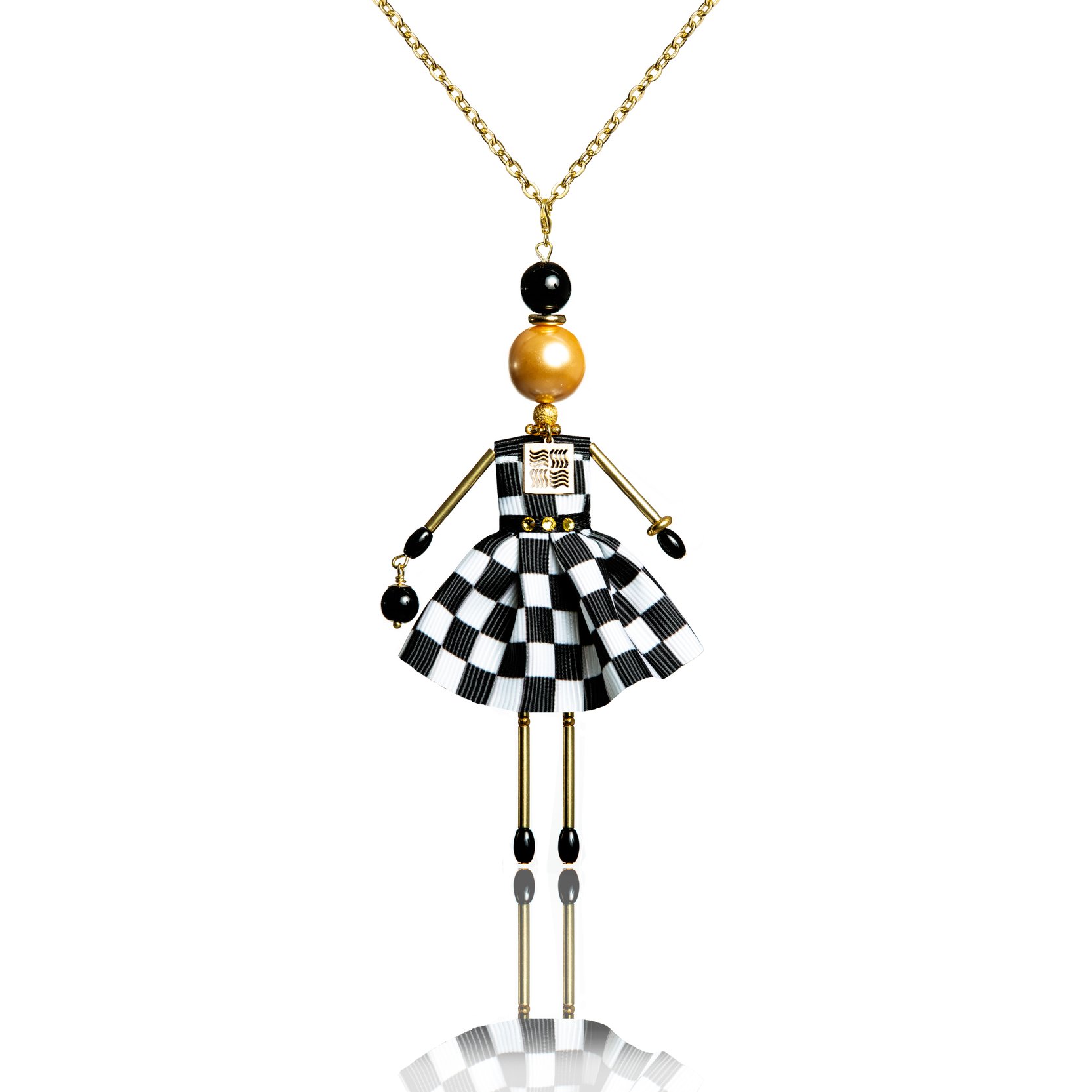 Exquisite pendant doll in a checkerboard print dress.