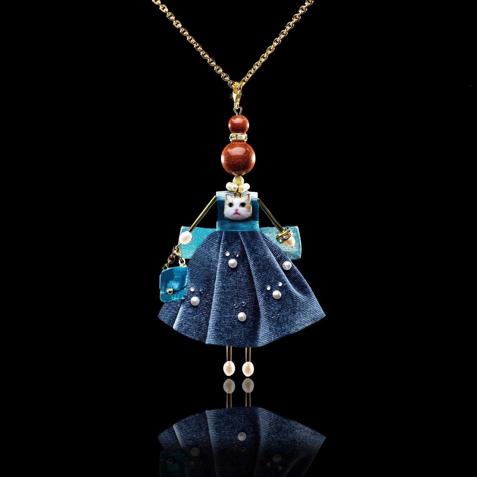 Jewelry doll pendant &ldquo;Basti&rdquo; on a black background