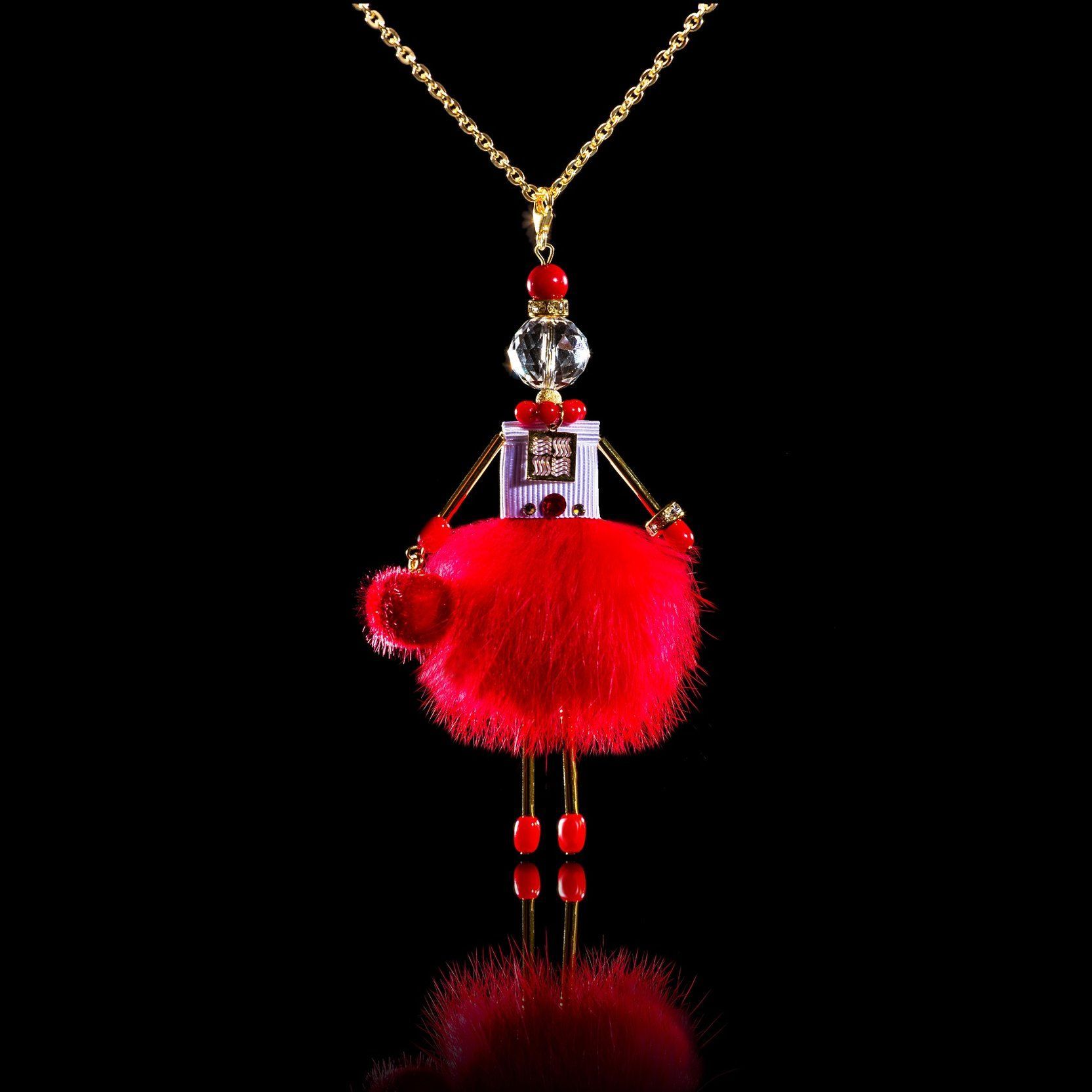 Jewelry doll pendant "Lady in Red" on a black background