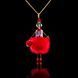 Jewelry doll pendant "Lady in Red" on a black background