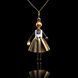 SARANA&reg; Asteria Jewelry Doll Pendant with a gold-colored pearl on a black background