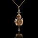 Jewelry doll pendant "Charming Friend" on a black background