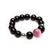 Bracelet with black agate and pink stone.
