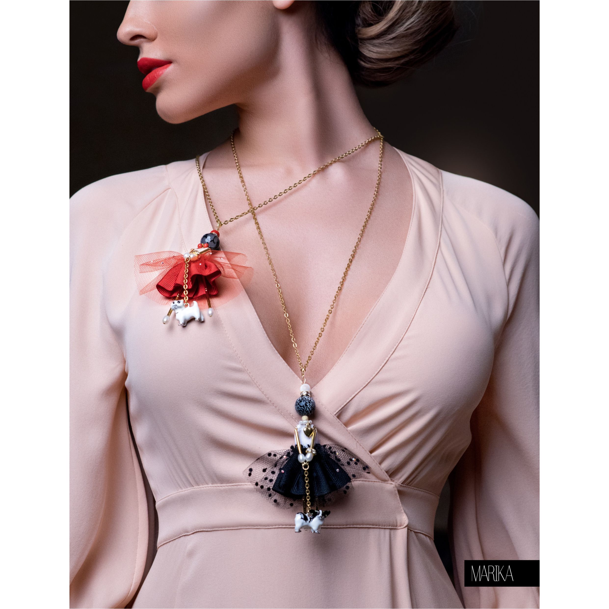 Two SARANA® jewelry doll pendants with dogs in black and red colors