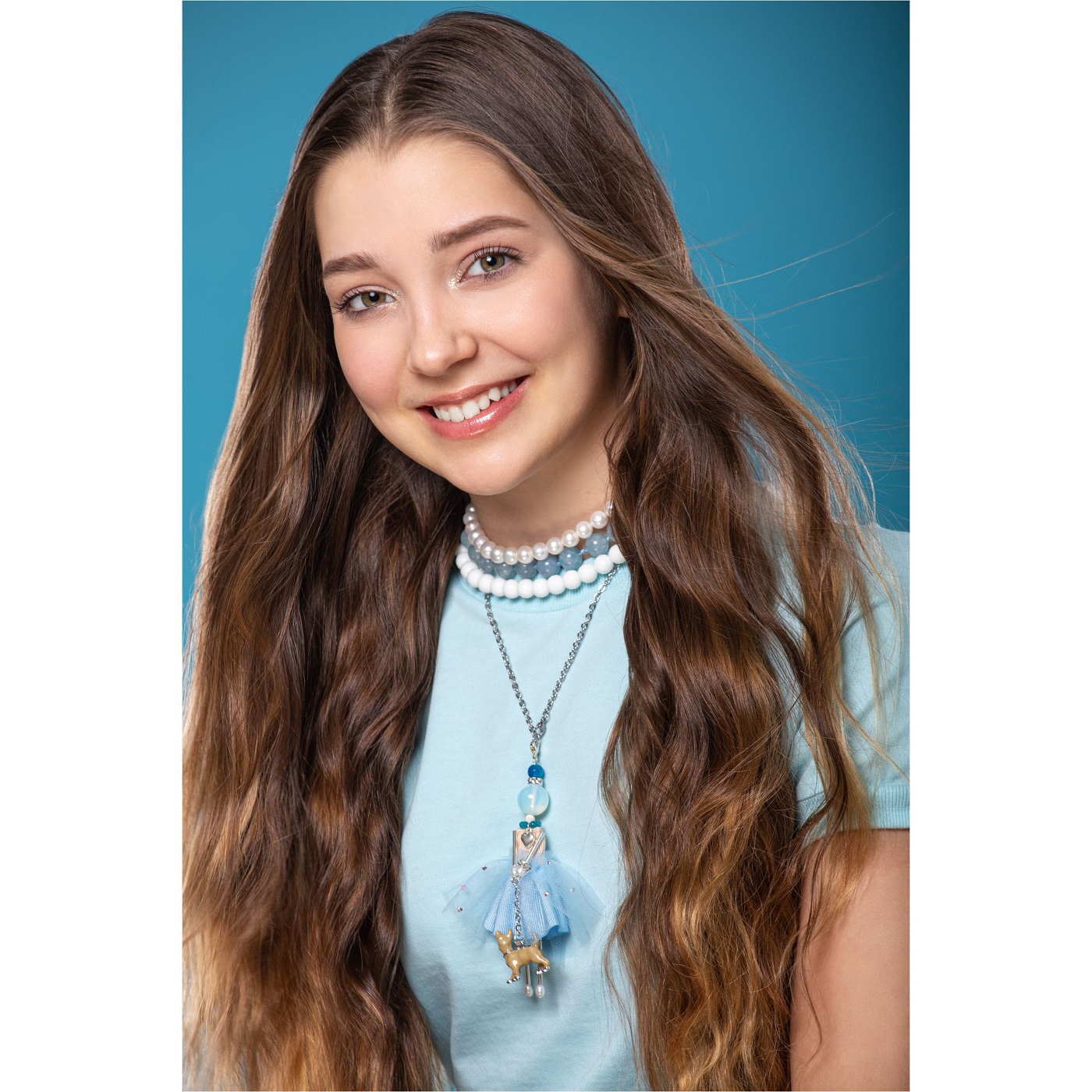 girl with a blue pendant from the “Devotion” collection