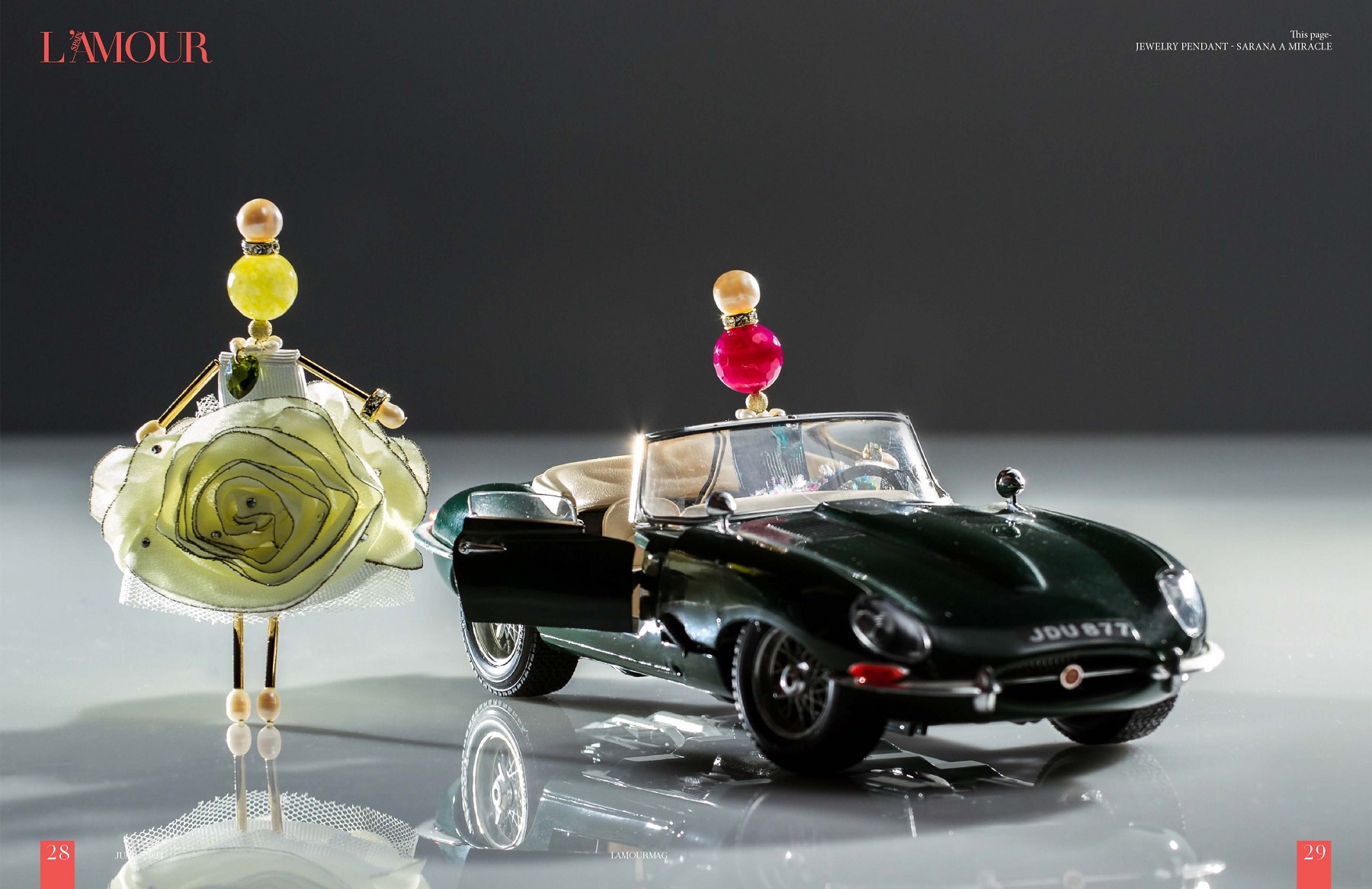 Exclusive SARANA® jewelry doll pendants posing beside a car for a creative art project