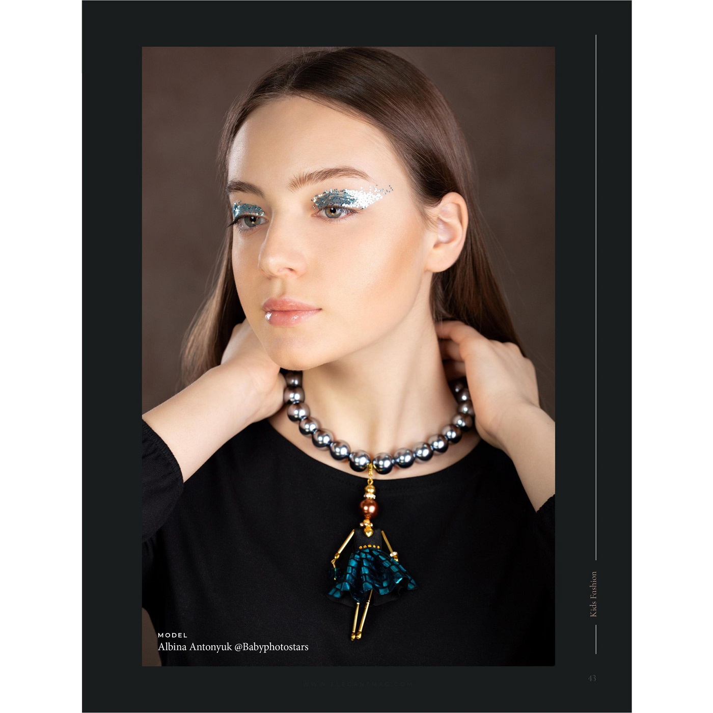 SARANA® jewelry doll pendant in a shimmering blue-turquoise iridescent outfit
