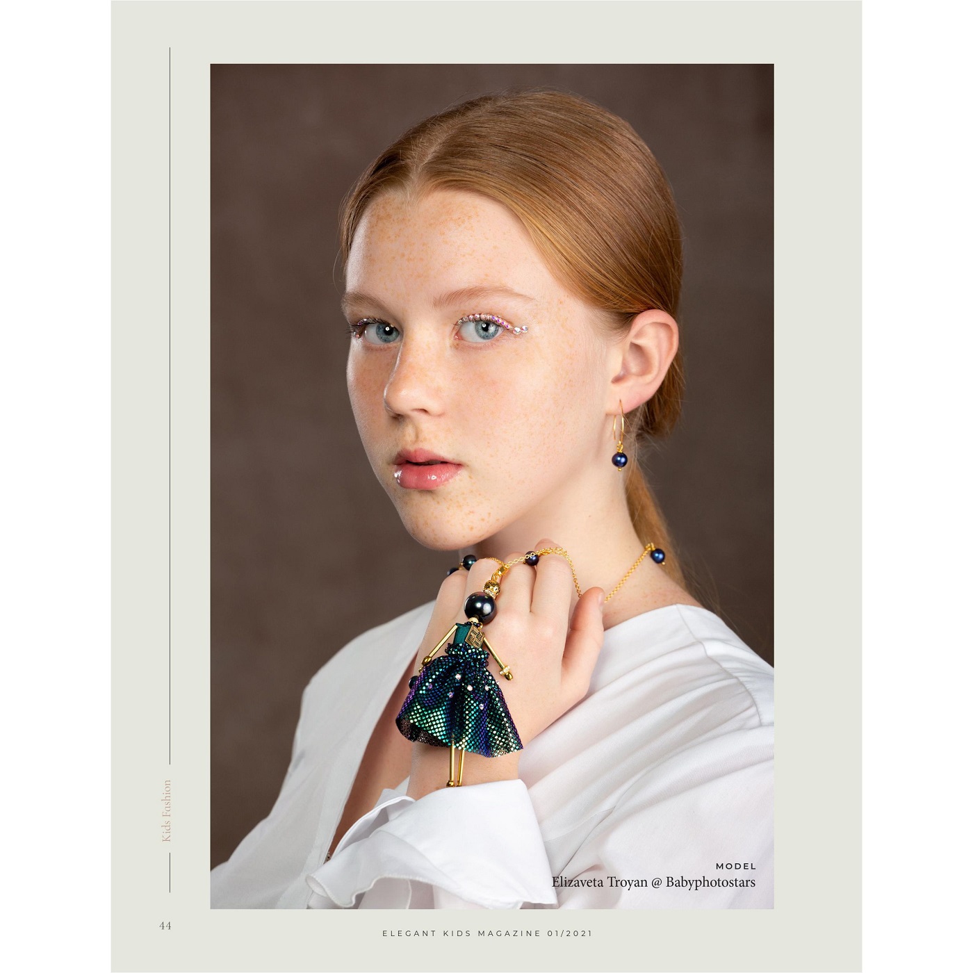 SARANA® doll pendant with graphite pearls in a peacock-feather inspired outfit