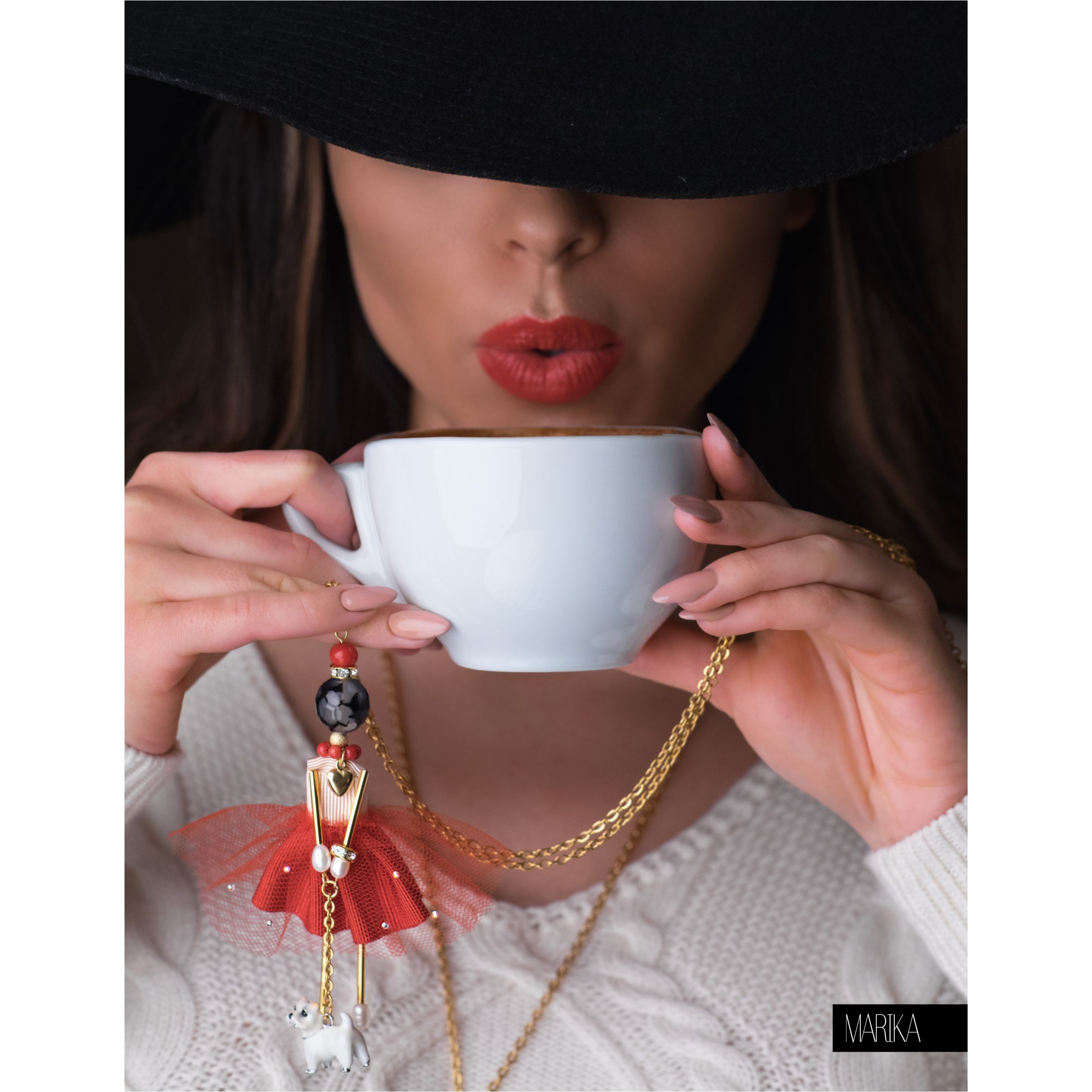 Striking red SARANA® doll pendant with a miniature dog figurine