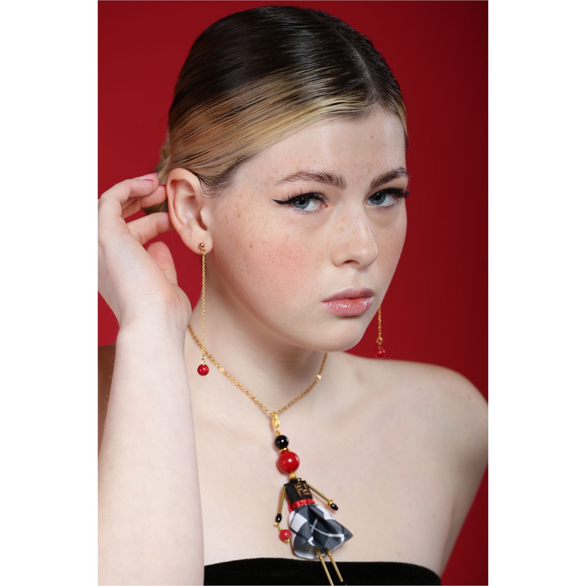 Jewelry doll pendant with red coral, a black-and-white printed skirt, coral earrings and a gold chain — an original gift for a stylish woman
