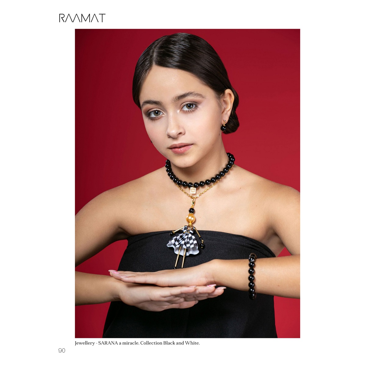 Jewelry doll pendant with pearls, a bracelet, and a black agate necklace — SARANA® fashion accessories featured in a Paris fashion magazine