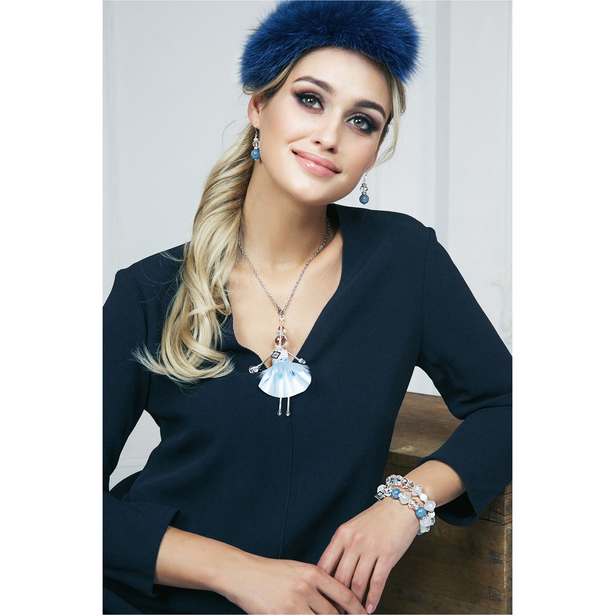 SARANA® jewelry doll pendant from the “Crystal Symphony” collection with rock crystal and a sky-blue outfit — brilliance and luxury.