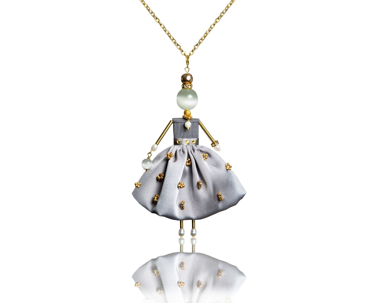 SARANA® jewelry doll pendant with a silver silk skirt hand-embroidered with Preciosa® beads from the “Touch of Silk” collection.